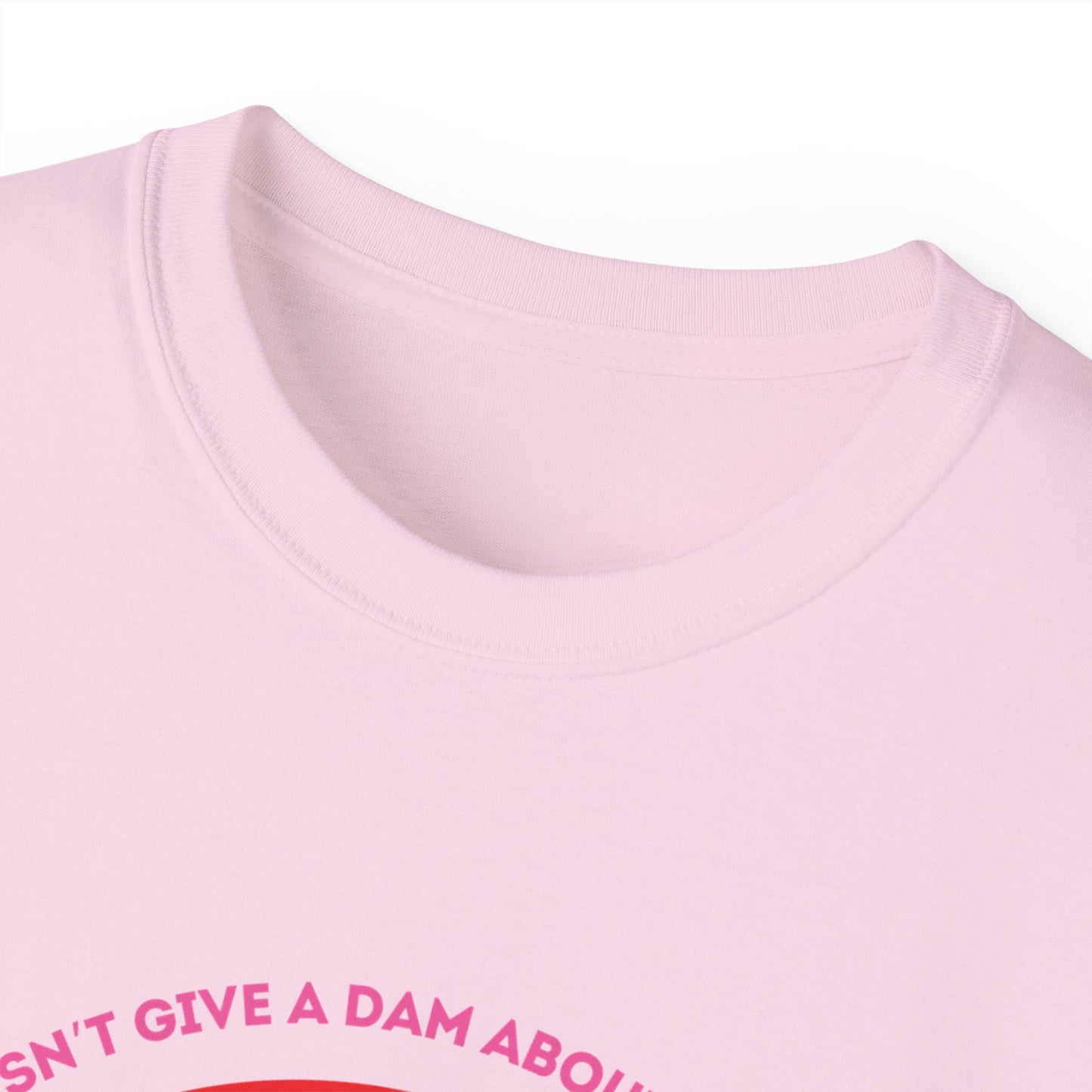 Collar detail of Bober Doesn’t Give a Dam T-shirt – soft black cotton fabric, pink colour version