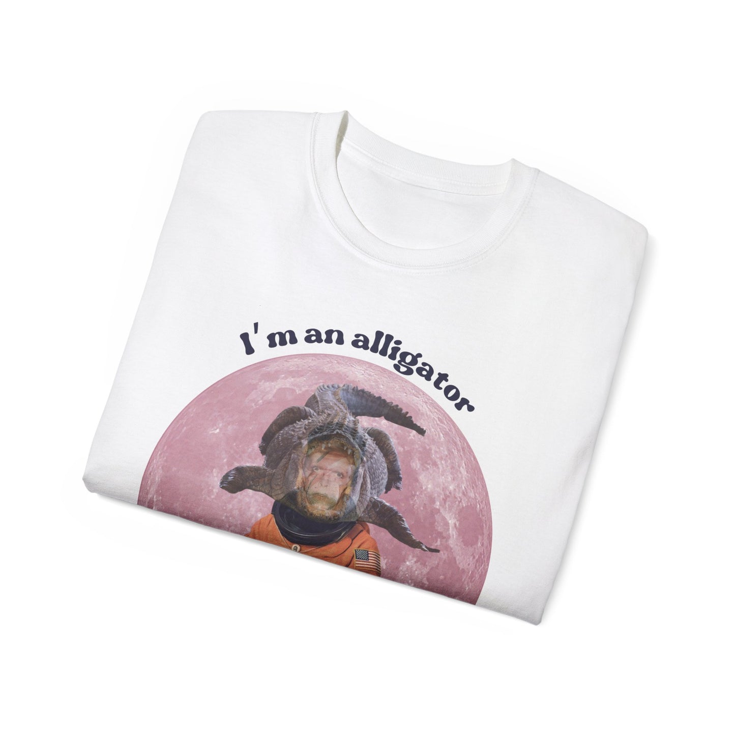 Folded Moonage Daydream T-shirt partially showing Bowie, moon, and alligator design on fabric