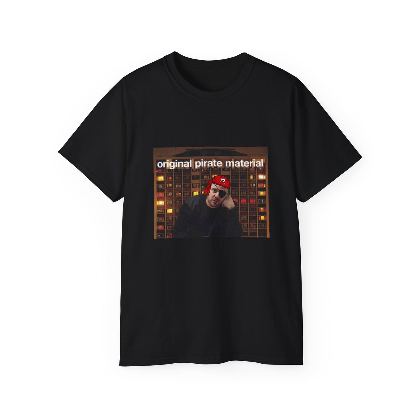 Front view of Original Pirate Material T-shirt featuring Mike Skinner dressed as a pirate in front of tower block black colour version