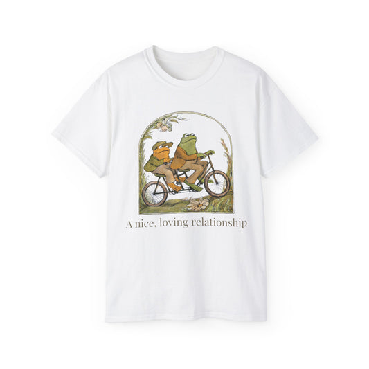 Front view of A Nice, Loving Relationship T-shirt featuring two cartoon frogs riding a bicycle with caption “A nice, loving relationship”