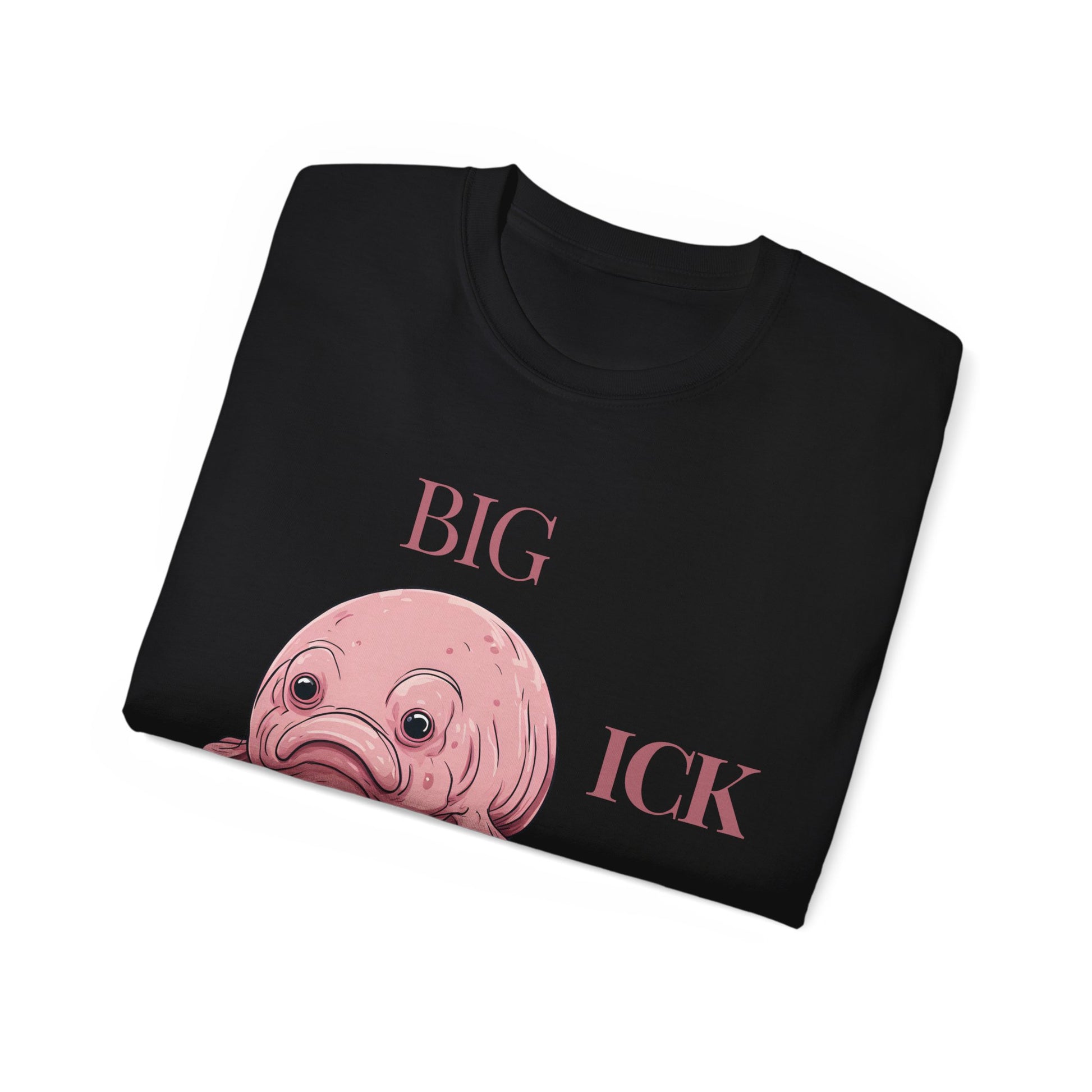 Folded Big Ick Energy T-shirt with partial view of creature design