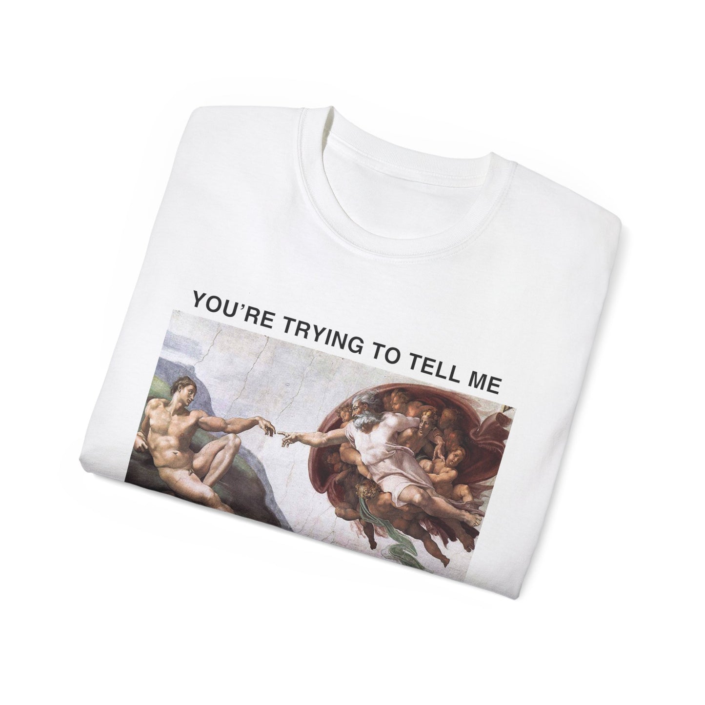 Folded Cis Teen Chapel T-shirt partially showing Michelangelo-style artwork and satirical caption on fabric