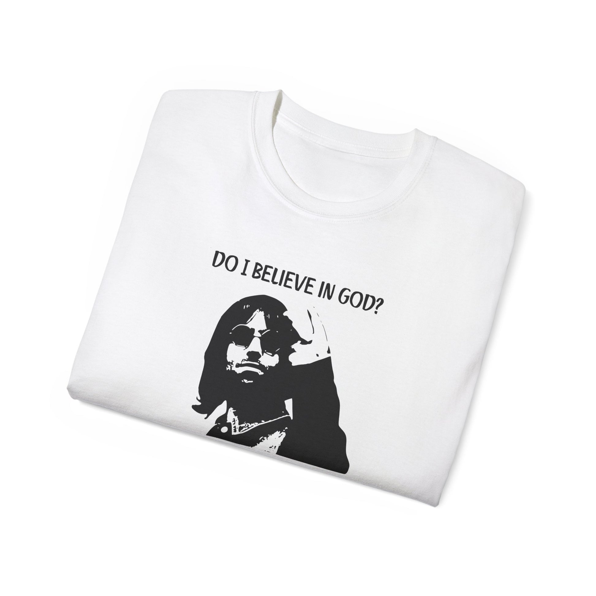 Folded Mancunian Self-Belief T-shirt partially showing Liam Gallagher illustration and quote on fabric