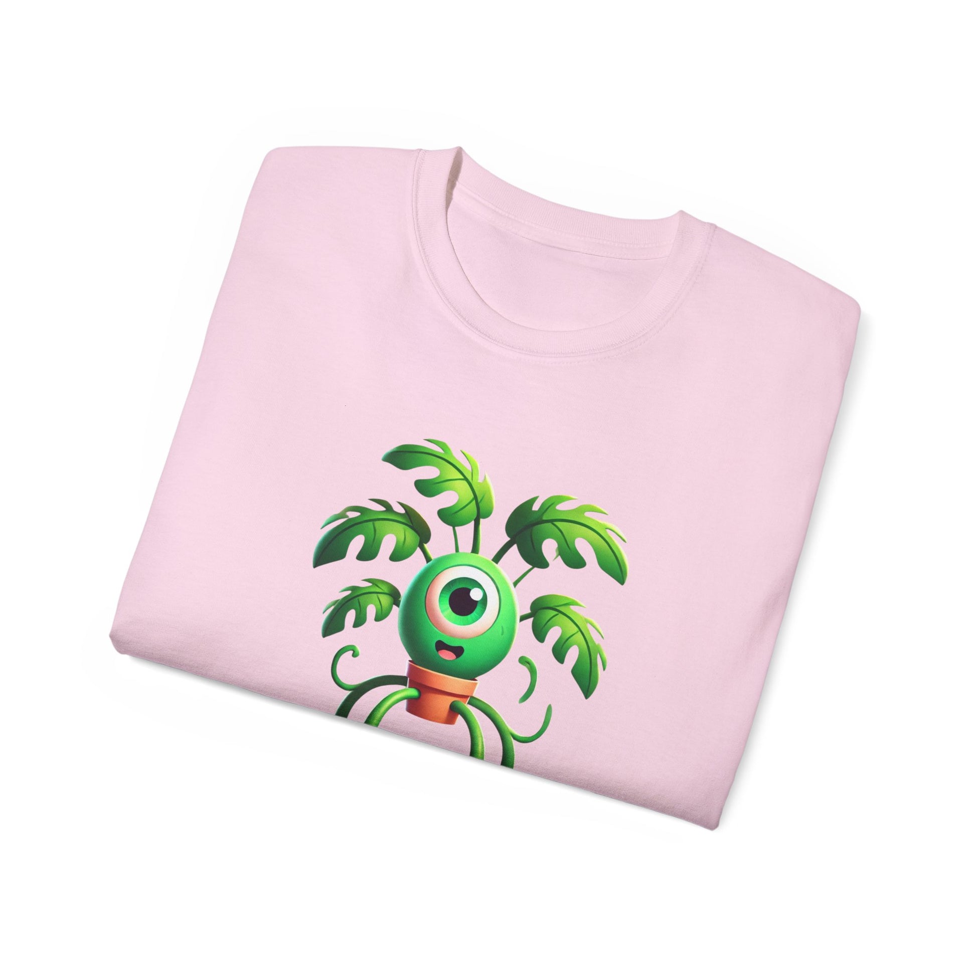 Folded Monstera Inc. T-shirt showing part of plant-monster design, pink colour version