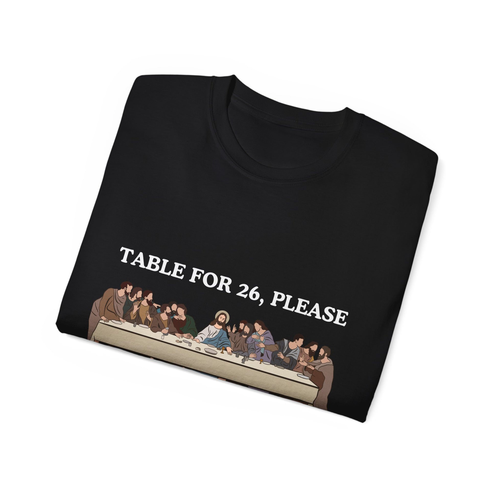 Folded Table for 26 T-shirt partially showing apostles design on fabric