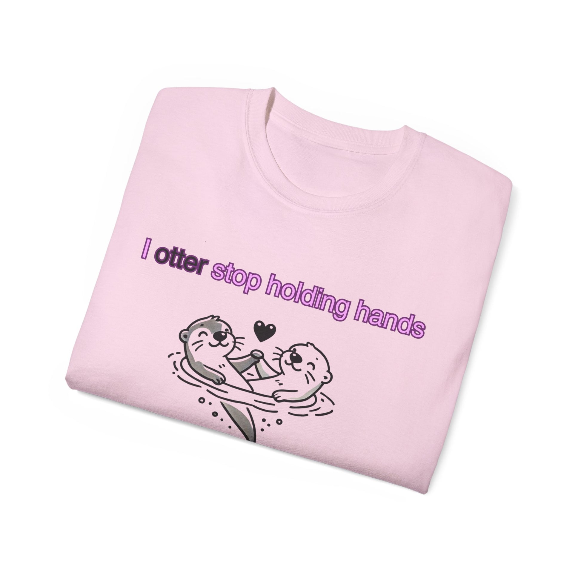 Folded Why I Otter T-shirt with otter hands partially visible, pink colour version